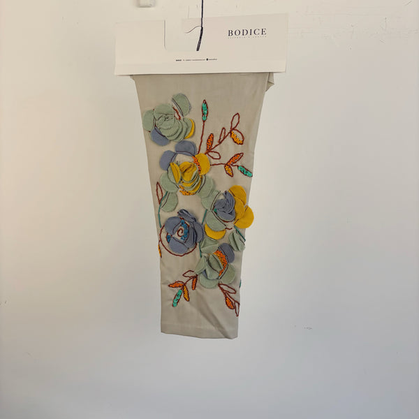 •	Embroidered Sleeves